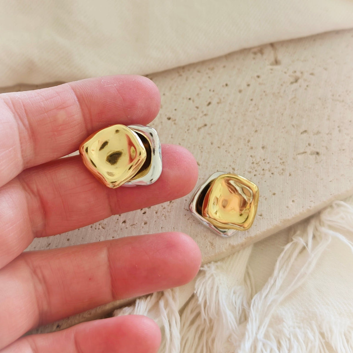 Molten Square Stud Earrings gold bicolor flat lay