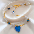 Blue glass heart beaded necklace with gold details